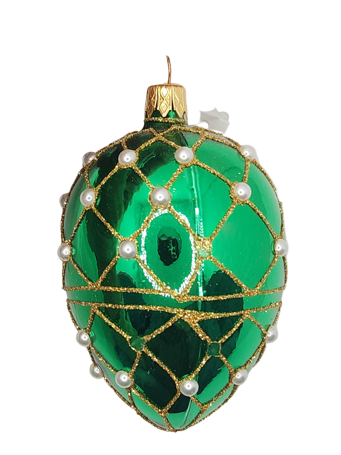 Decorative green egg with gold and pearl details against a white background