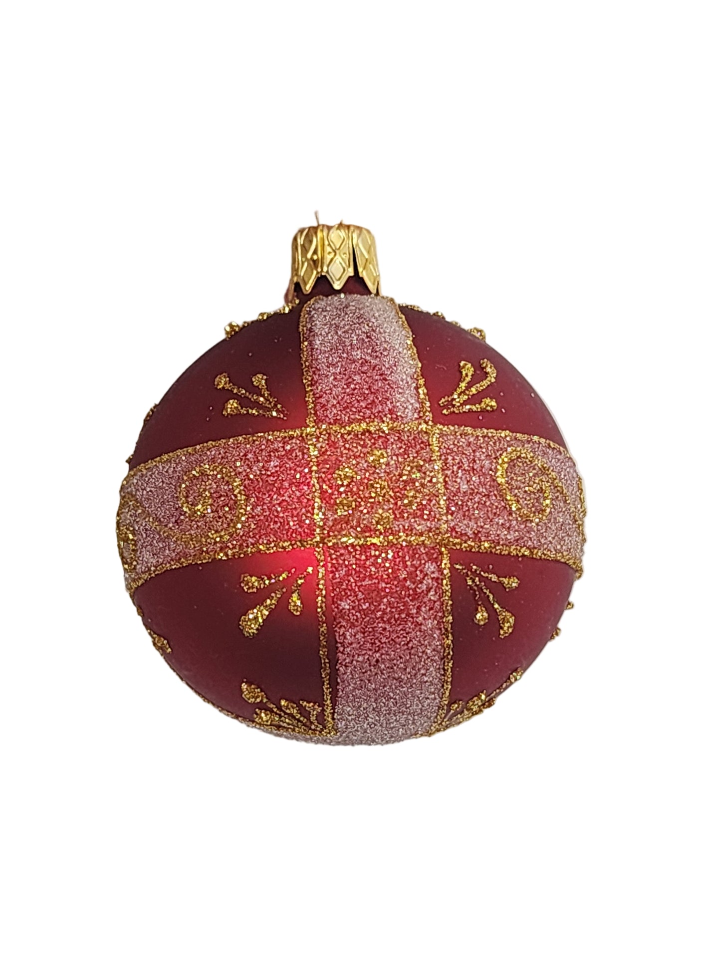 Decorative red and gold ornament on a white background