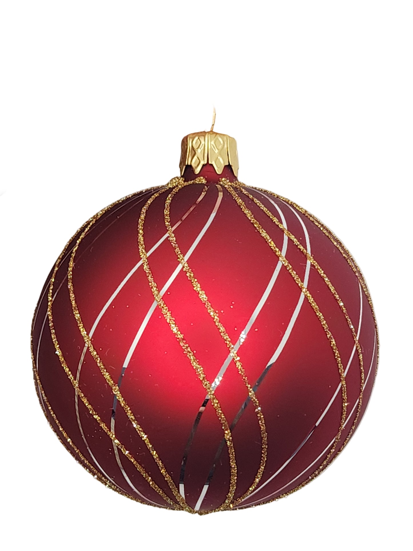 Red Christmas ornament with gold and white decorations against a light gray background