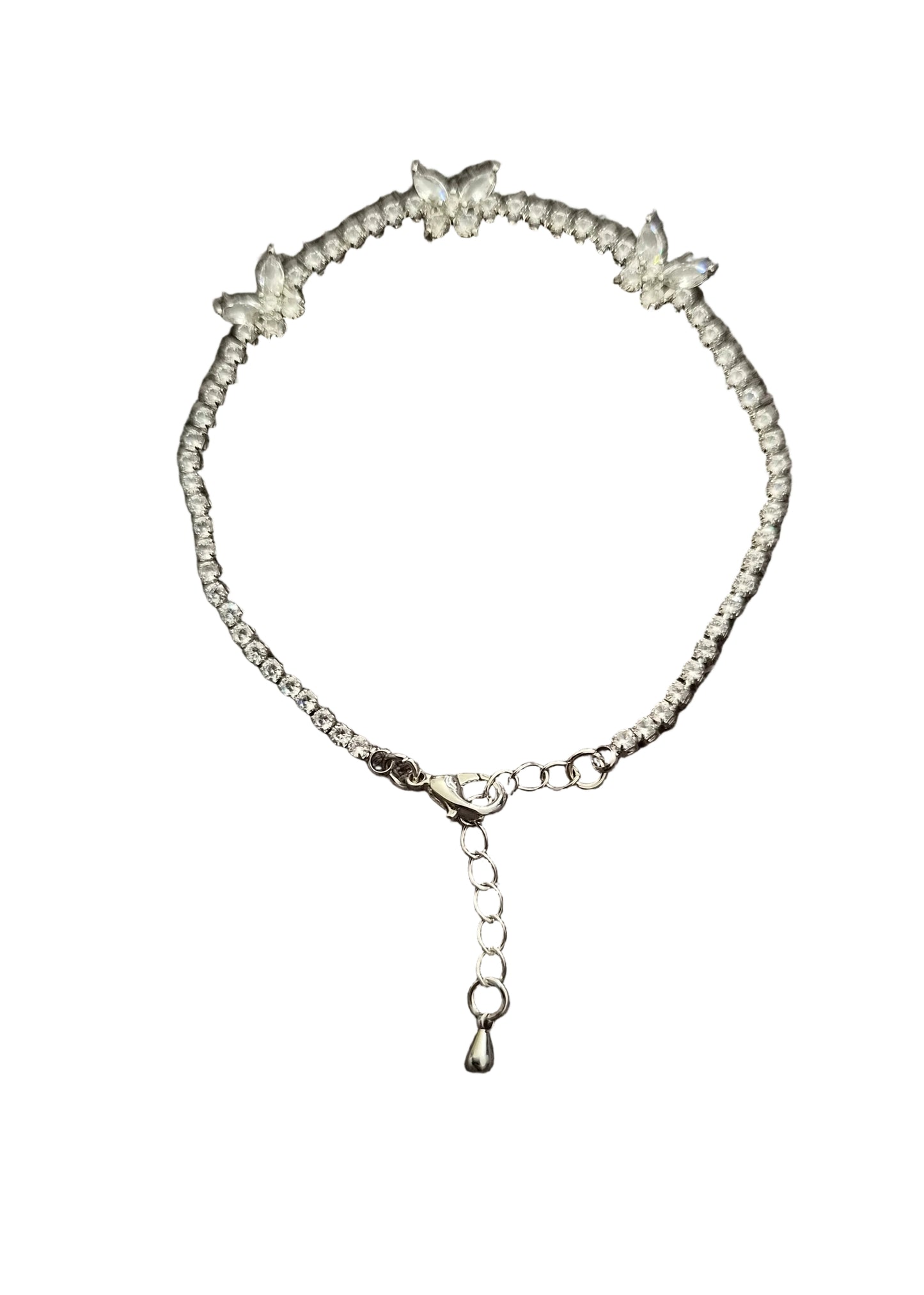 A delicate silver-toned beaded bracelet with three butterfly motifs and a dangling chain clasp.