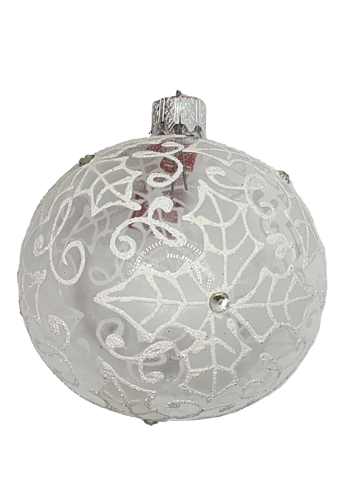 Decorative glass ornament with intricate patterns against a light background