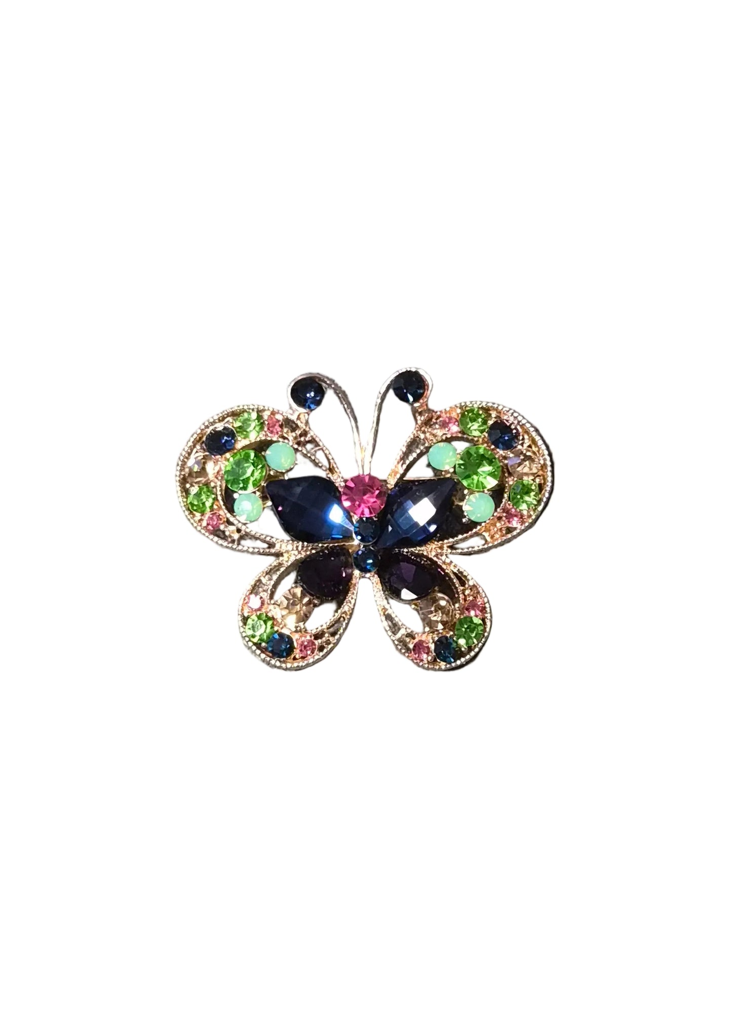 A butterfly-shaped brooch with iridescent multicolor crystals and a dark blue center