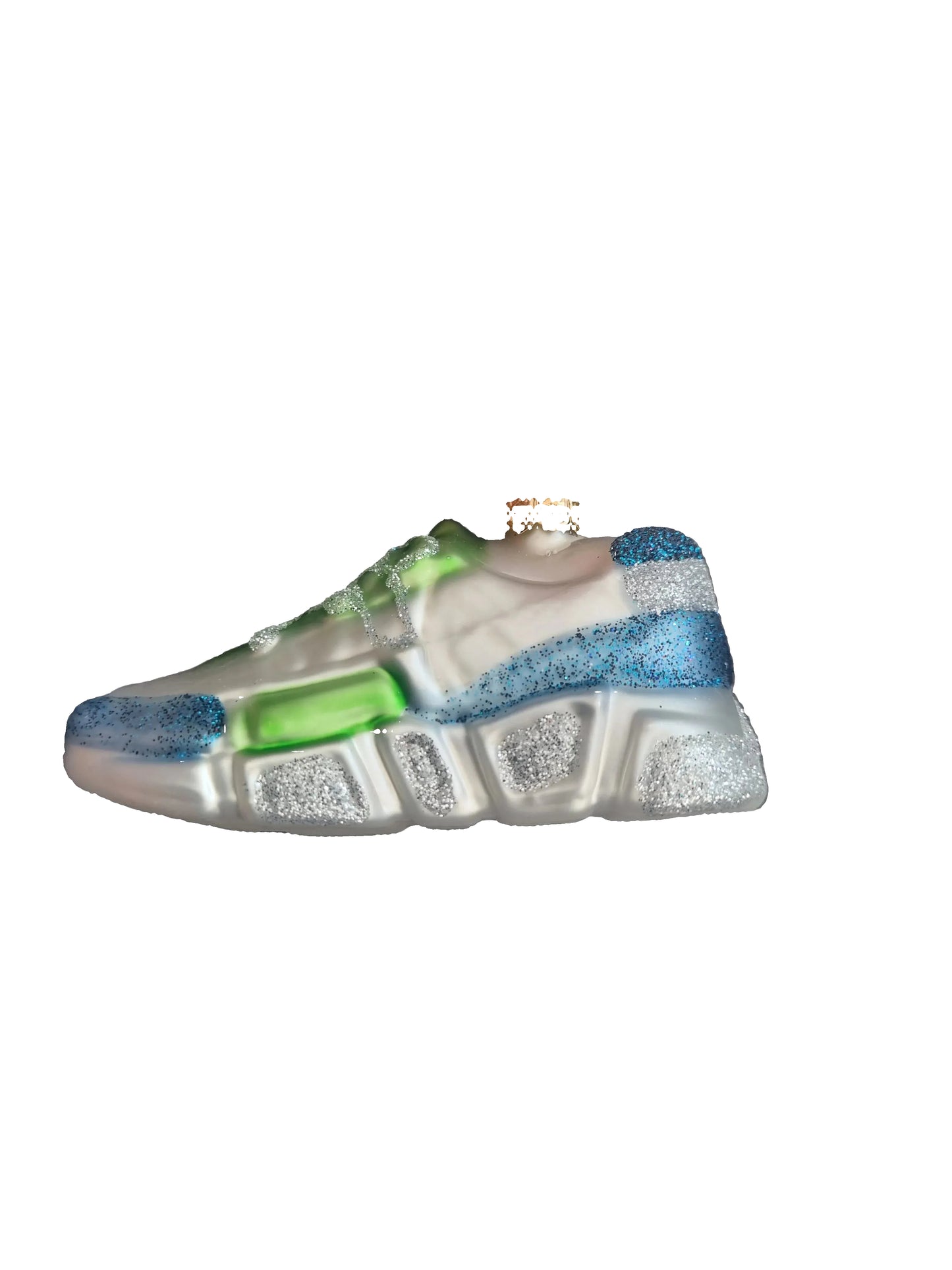 Small glass ornament of a shoe with colorful sole 