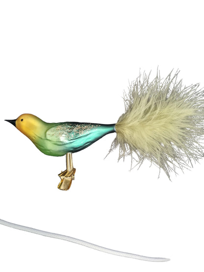 Colorful bird-shaped glass Christmas ornament on a clip
