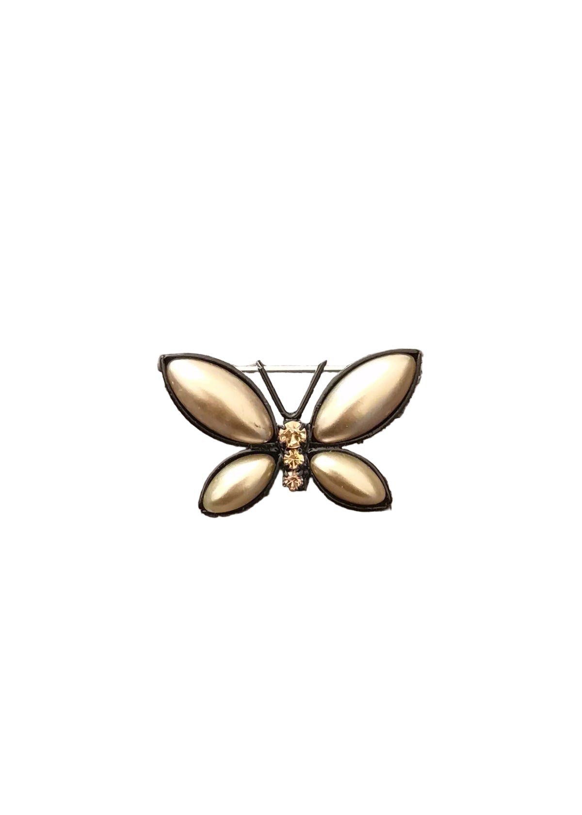 A butterfly-shaped brooch with four teardrop-shaped gold-toned petals and a small gold center detail.