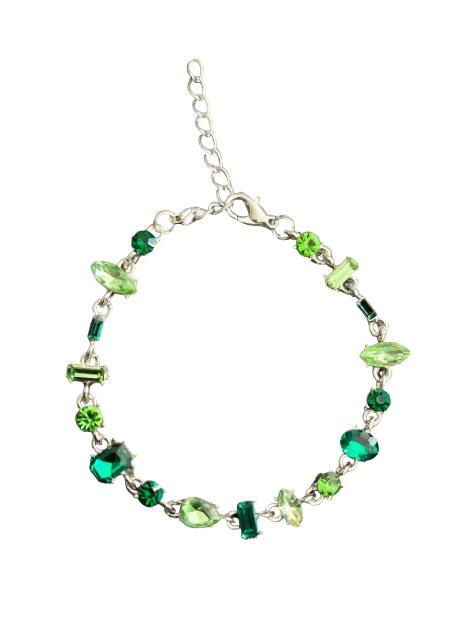 A silver chain bracelet with various green faceted gemstone charms.