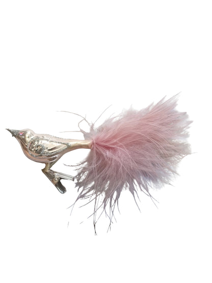 Decorative bird with pink feathers and a metallic clip base