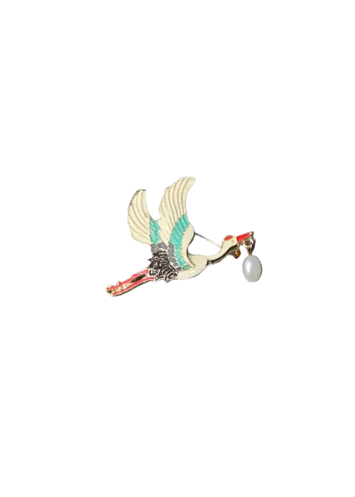 A bird-shaped brooch with white, teal, and red enamel details