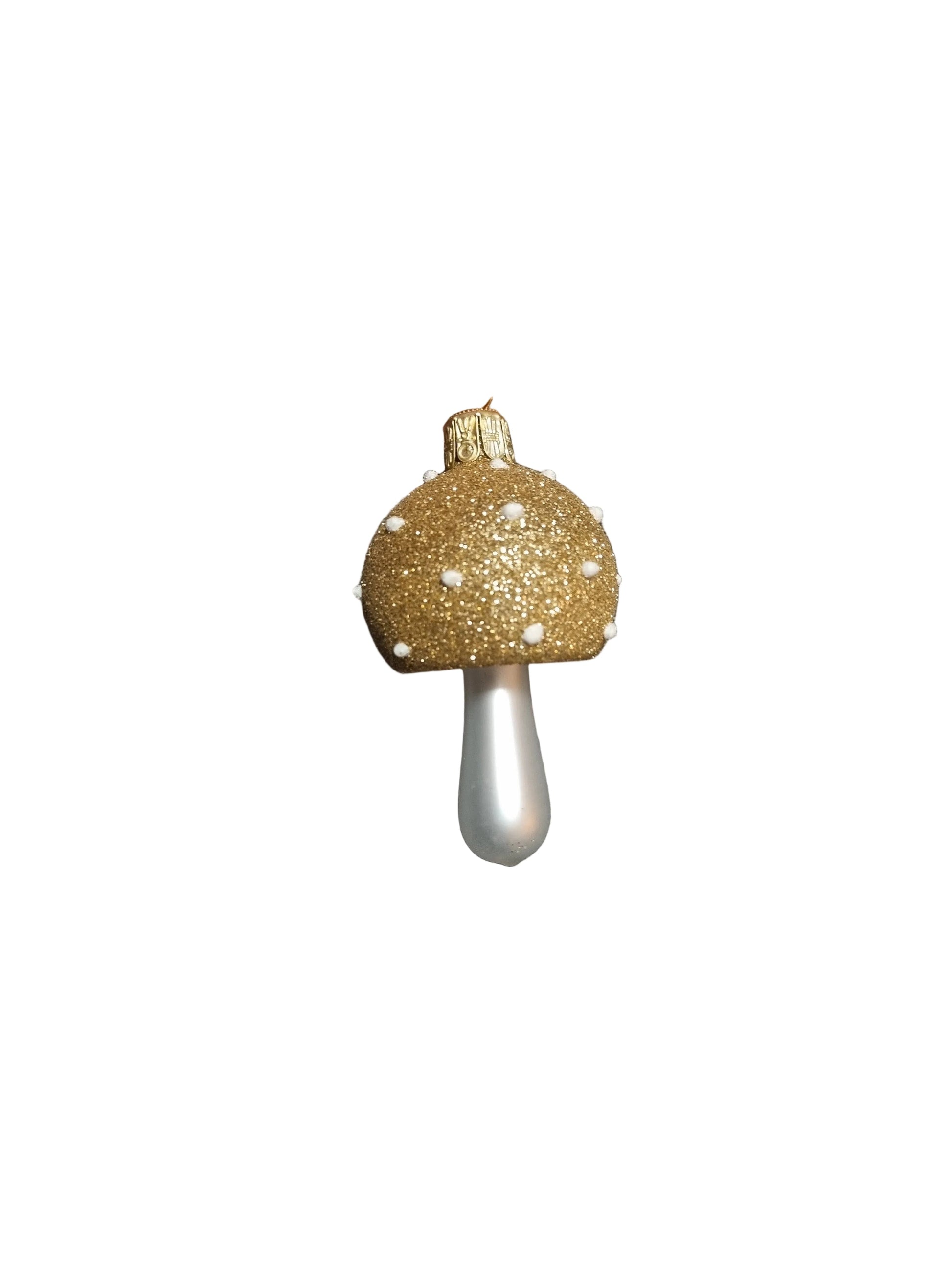 Glass ornament of a mushroom with a gold top
