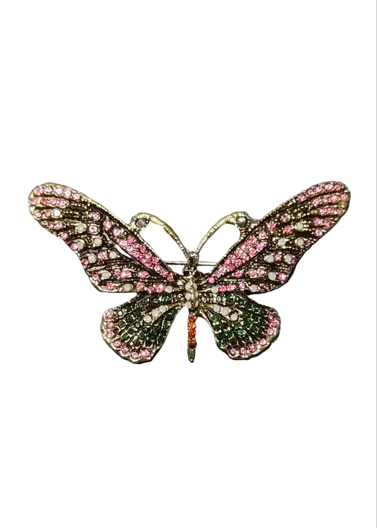 A butterfly-shaped brooch with pink and green crystal-encrusted wings and a gold-tone body