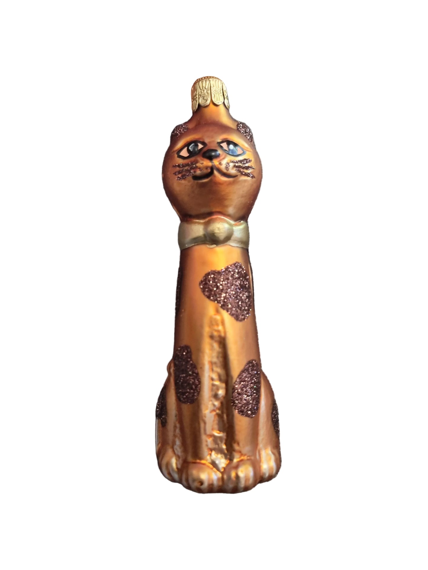 Bronze-colored cat with intricate designs 