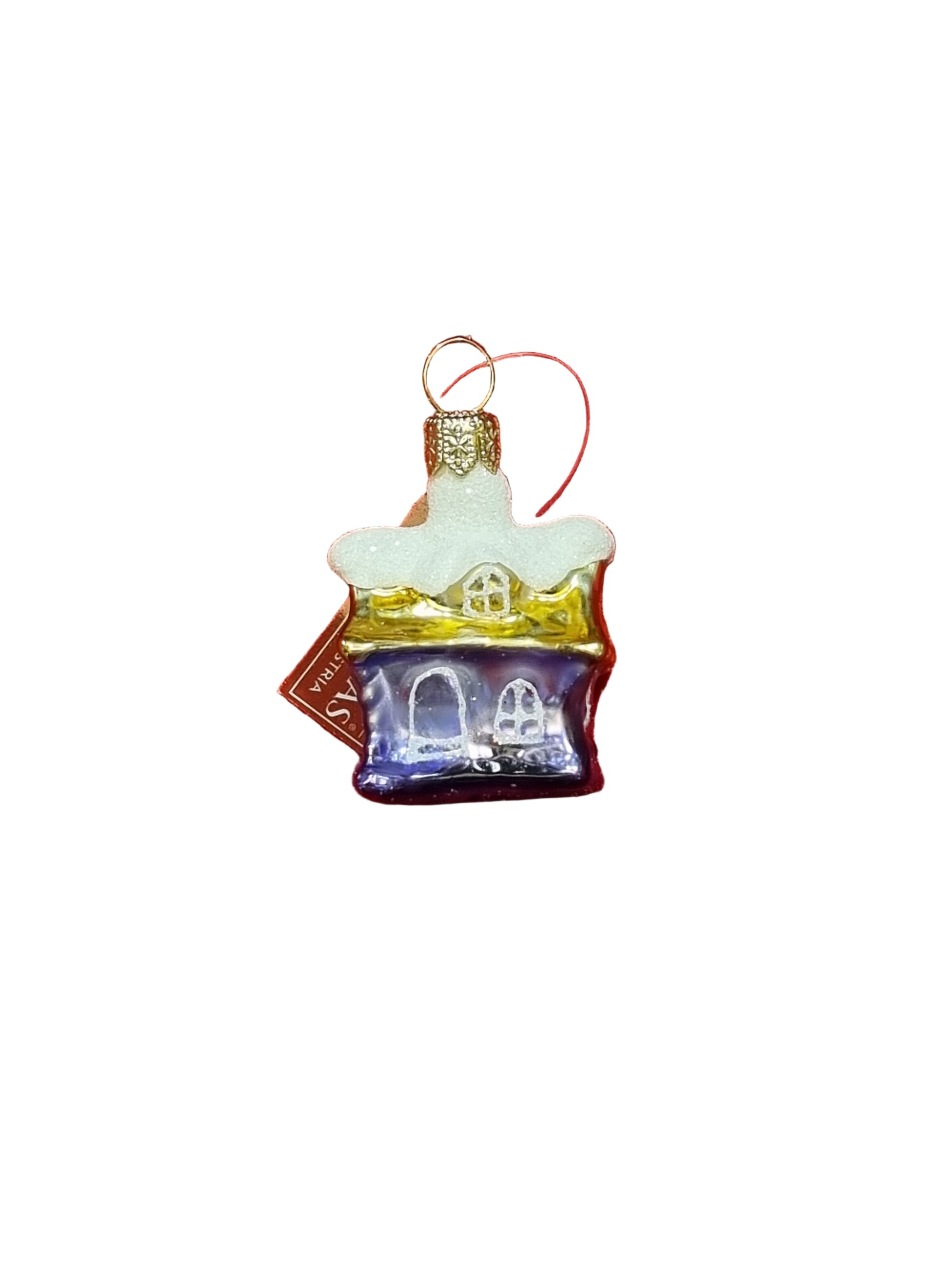 Glass ornament shaped like a house with a white roof on a white background