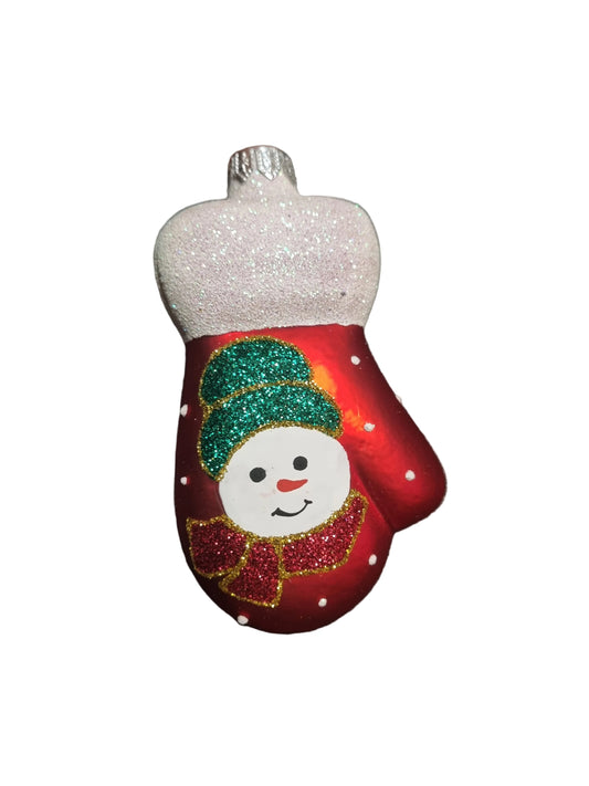 Decorative red mitten ornament with a snowman design on a gray background