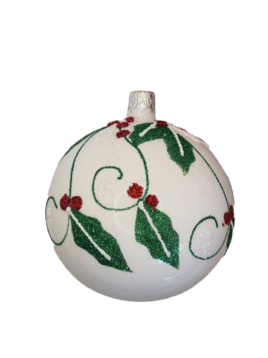European Glass Christmas ornament of a white bauble with red & green glitter leaves